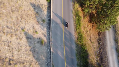 Motorcycle-Driving-Overlooking-Okanagan-Lake-|-Birds-Eye-Looking-Down-|-Lakecountry,-British-Columbia,-Canada-|-Okanagan-Landscape-|-Scenic-View-|-Wine-Vineyard-Rows-|-Lakeside-Shoreline-|-Summer-Time