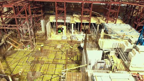 construction site aerial view: steel framework and concrete foundation