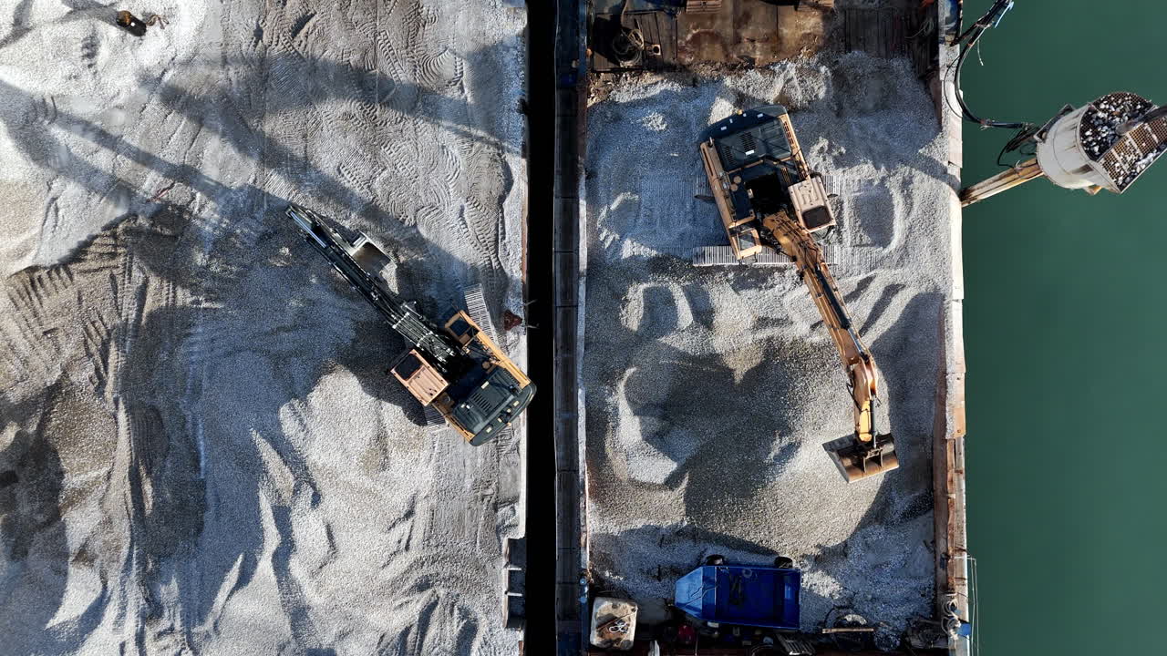 Aerial view of construction site with excavators in action
