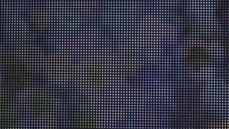 Extreme-close-up-shot:-an-LED-grid-display,-featuring-large-illuminated-dots-that-change-color-in-an-animated-sequence