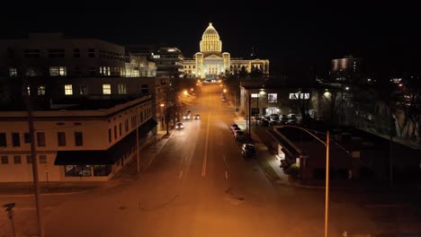 arkansas state capitol building at night in little rock, arkansas with drone video low and moving forward