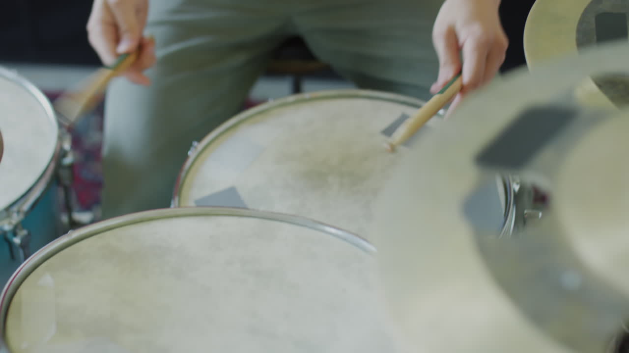 Close-up of a person playing drums