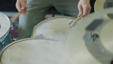 close-up of a person playing drums