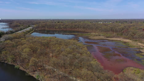 An-aerial-view-of-some-reflective-lakes-during-the-day