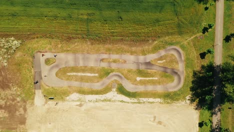 aerial view of people racing on a bicycle pump track in spisska bela, slovakia