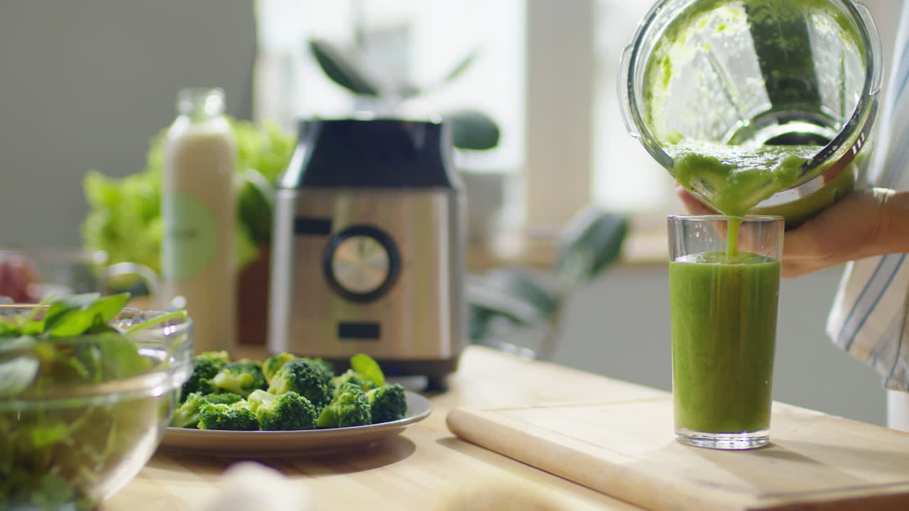 Filling Glass with Healthy Green Smoothie