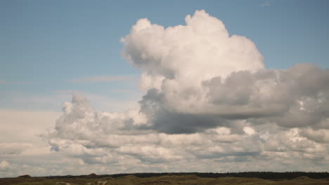 dramatic sky with cloud formation above sand dunes a the north sea cost in denmark