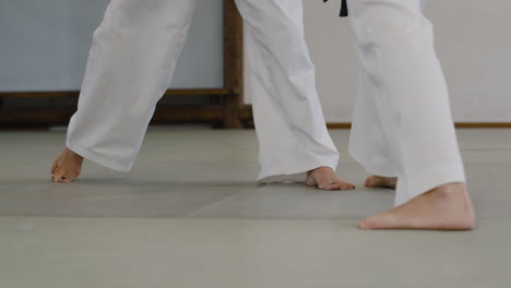 two athletes fighting indoors