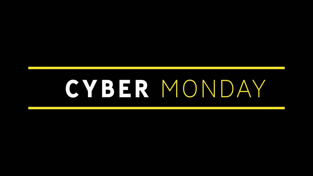 texto blanco y amarillo de cyber monday que aparece contra una pantalla negra