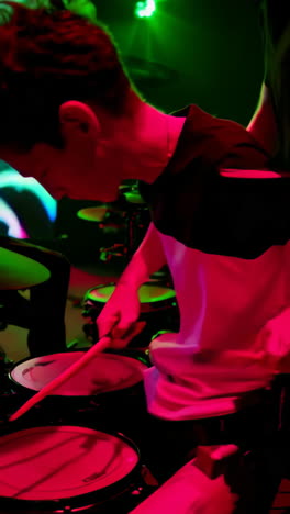 drummer performance in a colorful stage