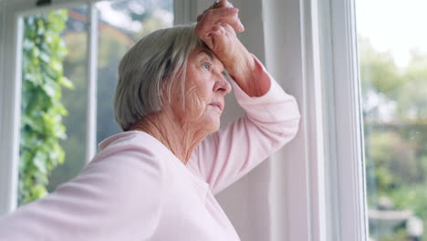 window, thinking and senior woman or alzheimer