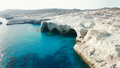 sarakiniko beach, rock coastline and caves, milos island, greece