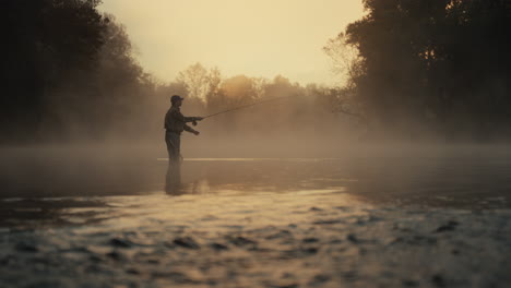 sunrise fly fishing on a misty river