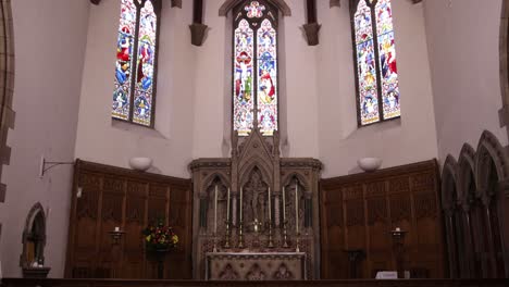 panning shot of stained glass windows interior of st andrews cathedral in inverness, scotland in the highlands