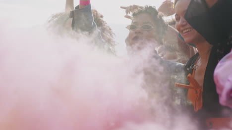 Group-Of-Young-Friends-Dancing-Behind-Barrier-At-Outdoor-Music-Festival