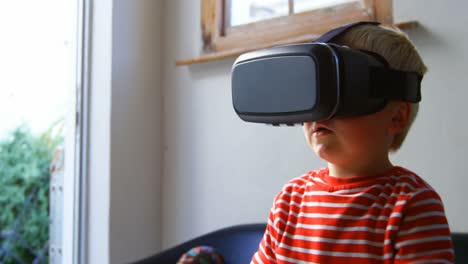 boy using virtual reality headset in living room 4k