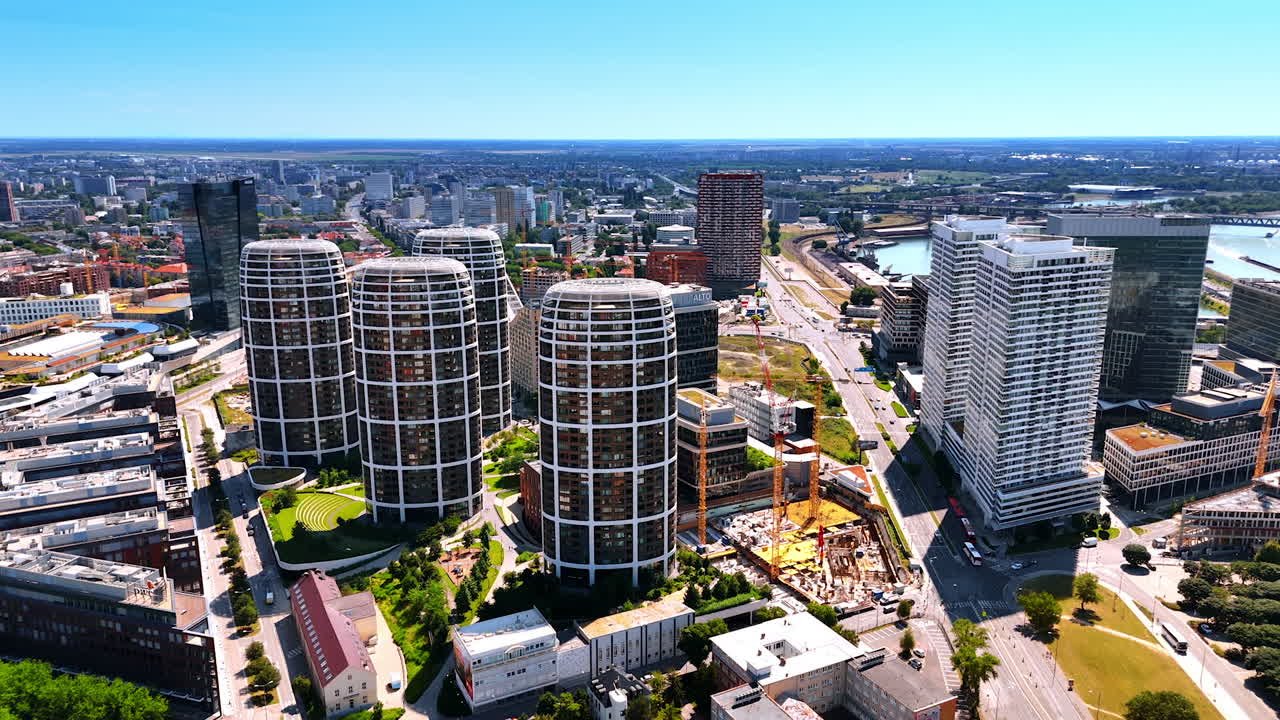 Bratislava modern skyline. Bratislava features modern architecture and green spaces under a clear blue sky, showcasing urban growth