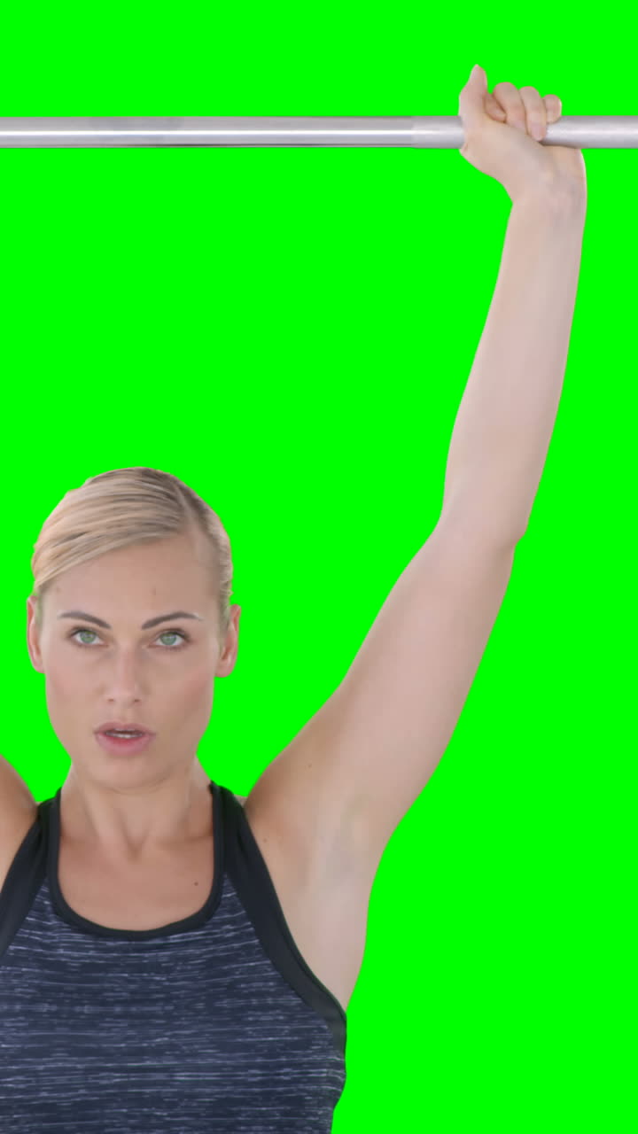 Woman lifting a dumbell