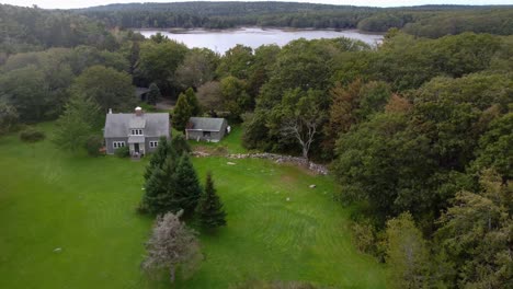 Fly-over-old-home-at-Popham-Beach-in-Maine