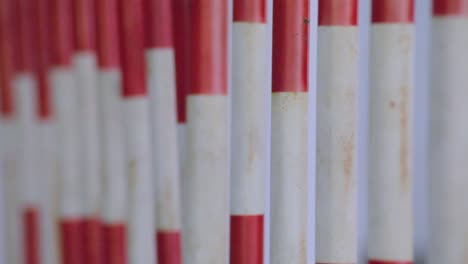 close up and rack focus of red and white moveable mass barriers