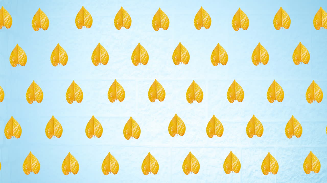 파란색 배경에 가을 노란색 잎의 줄의 애니메이션