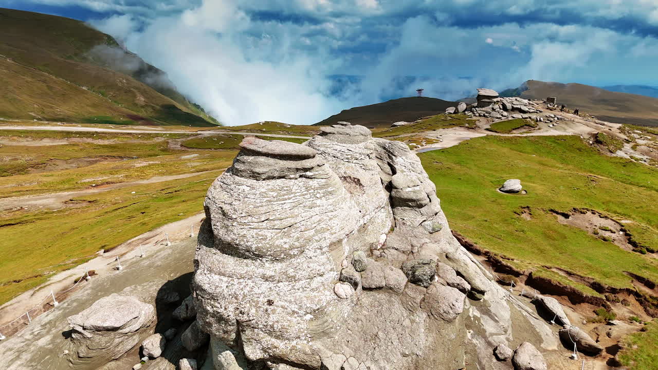 Weathered stone columns on Caraiman Plateau. Stone columns shaped by wind and erosion rise from the Caraiman Plateau in the Bucegi Mountains