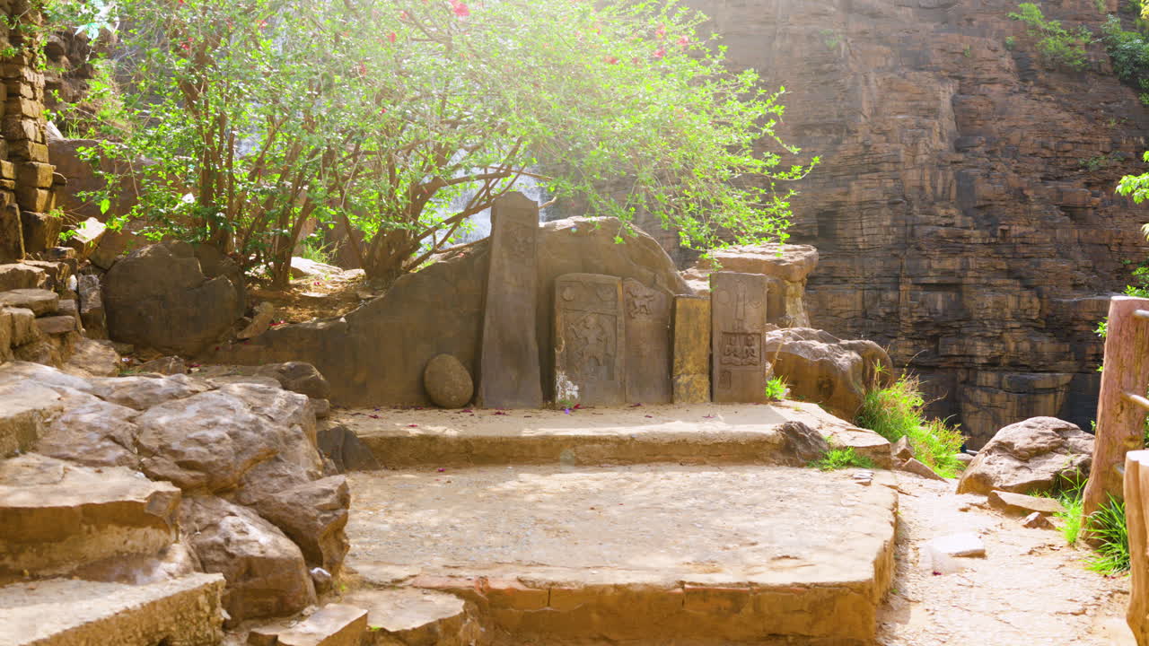 Ancient historical stone carving sculpture of Hindu gods near Bastar, Chhattisgarh, India. Camera track-in shot