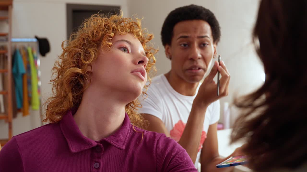 Friends doing makeup together