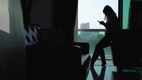 wide shot of young women using smart phone