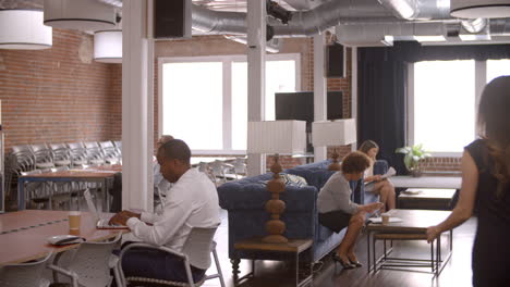 interior of busy modern office with staff working