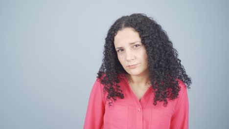 Young-woman-looking-at-camera-with-curious-expression.