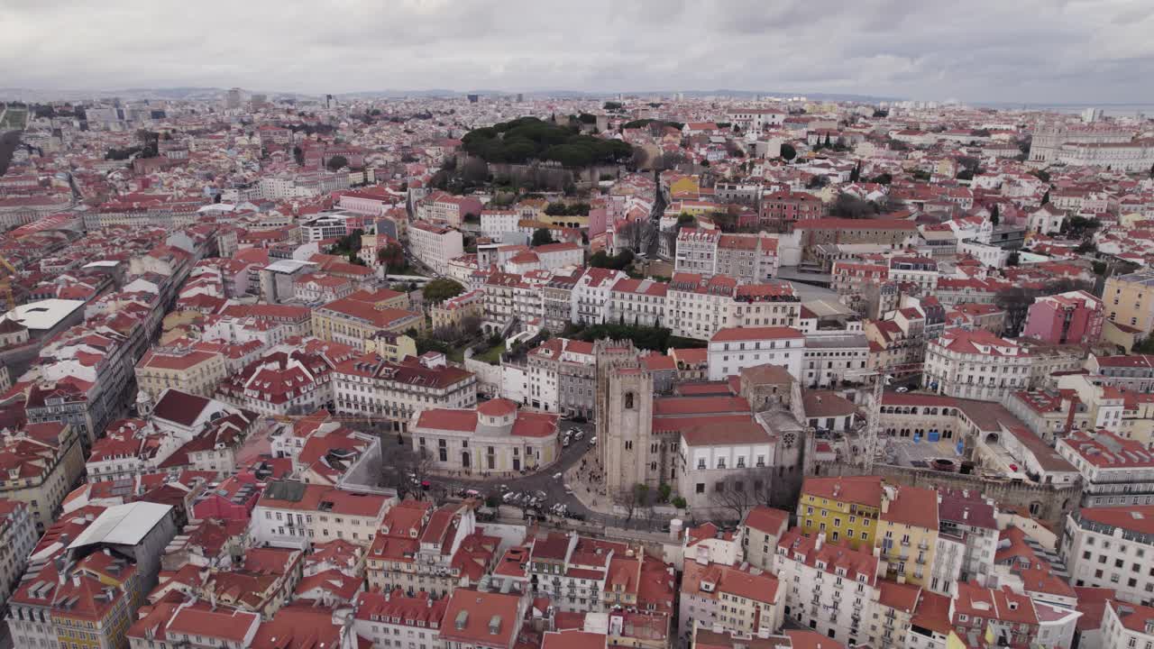 Aerial panorama view of Lisbon city with Lisbon Cathedral and S&atilde;o Jorge Castle on Cloudy Day