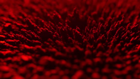 abstract-close-up-magnetic-powder-substance-under-the-action-of-a-magnet-in-red-light-spikes