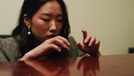 a young woman is engaged in a piano practice session, demonstrating concentration and skill while her fingers move gracefully over the surface. the environment is calm and intimate.