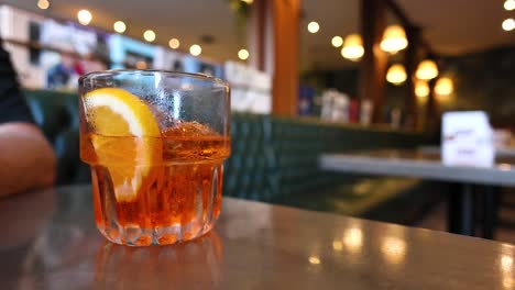 a person drinks a lemon cocktail