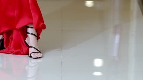 Shoes-become-focal-point,-revealing-heel-height-and-design-elements