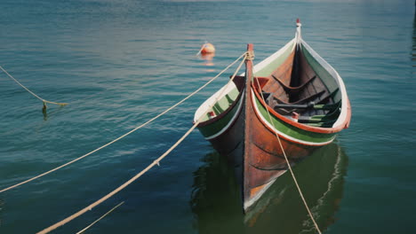 beautiful wooden boat moored at the shore 4k video