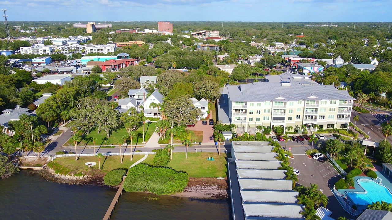 Dunedin, Florida waterfront living with coastal properties and abundant vegetation in aerial view