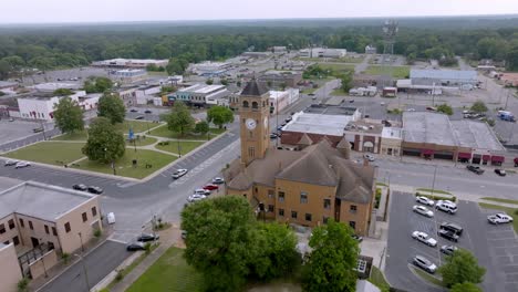 tuskegee, alabama downtown and macon county, alabama courthouse with drone video moving in