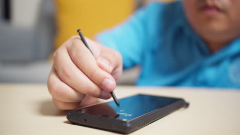 men use stylus pen technology on a smartphone to write and work with digital applications