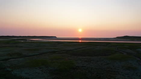 sunset above the mudflats on texel island in the netherlands