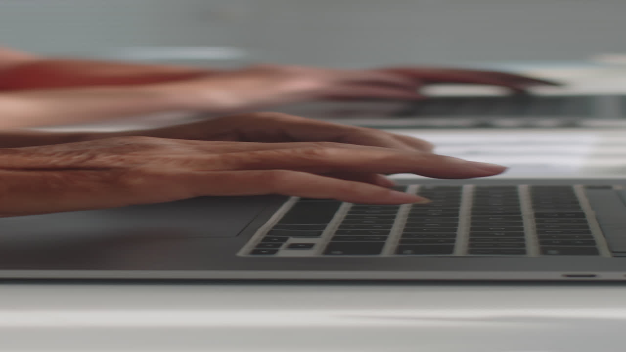Hands of Elderly People Typing on Laptops