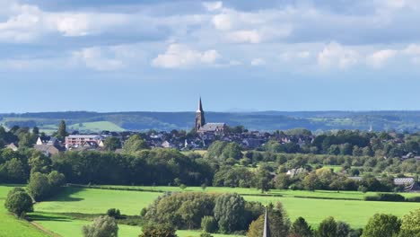 Beautiful Summer&rsquo;s day, picturesque village dominated by tall church spire