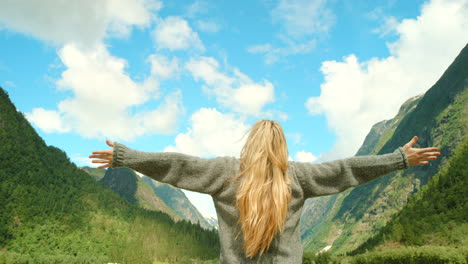 woman enjoying the view from norwegian mountains