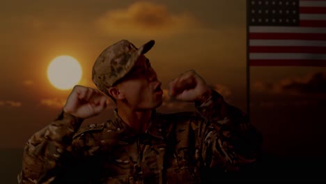 close up of asian man soldier dancing while standing with flag of the united states, sunset time