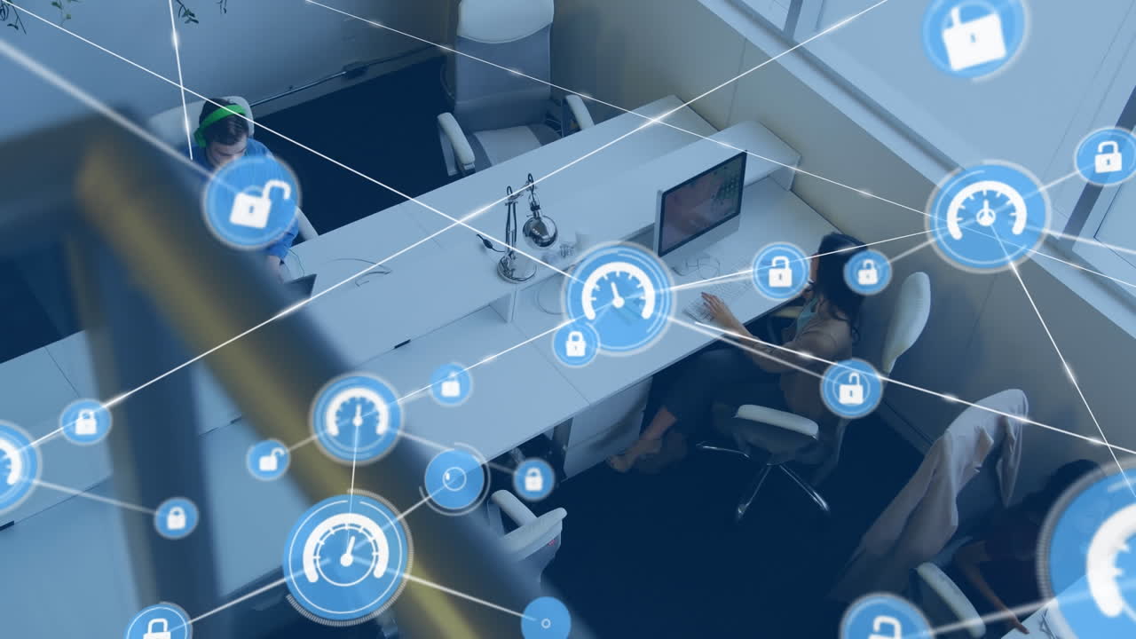 Animation of network of digital icons against overhead view of diverse people working at office