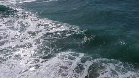 Crawling-Sea-Waves-Over-Foamy-White-Surface