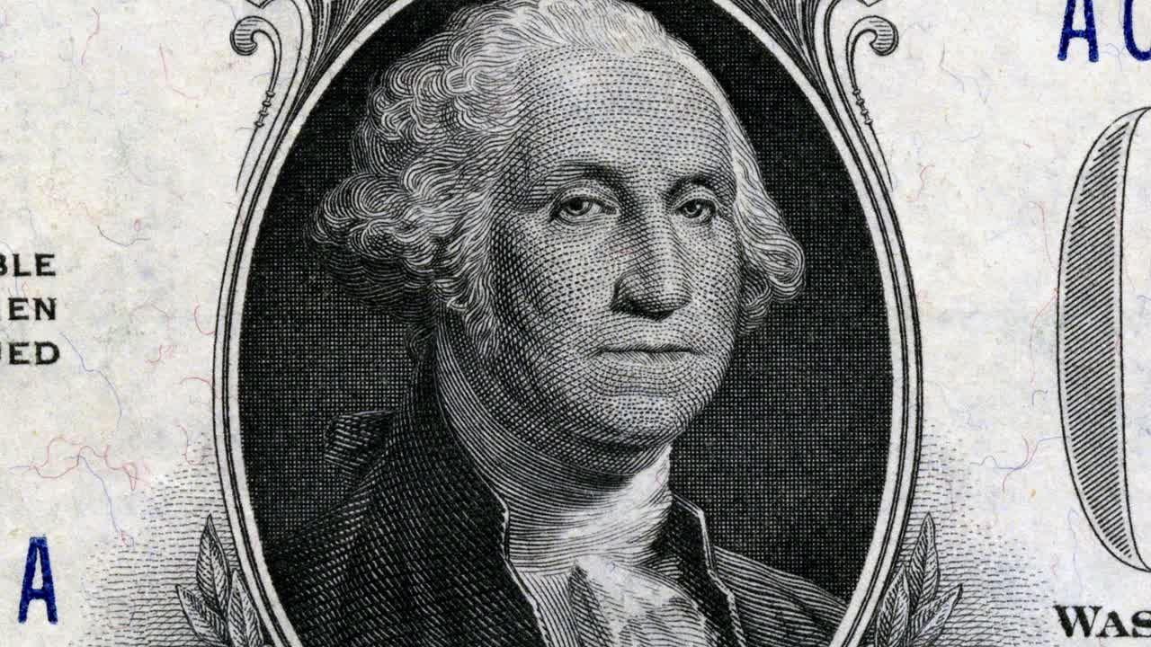 Satu Dolar dan potret George Washington yang kusut pada uang kertas Amerika Serikat.