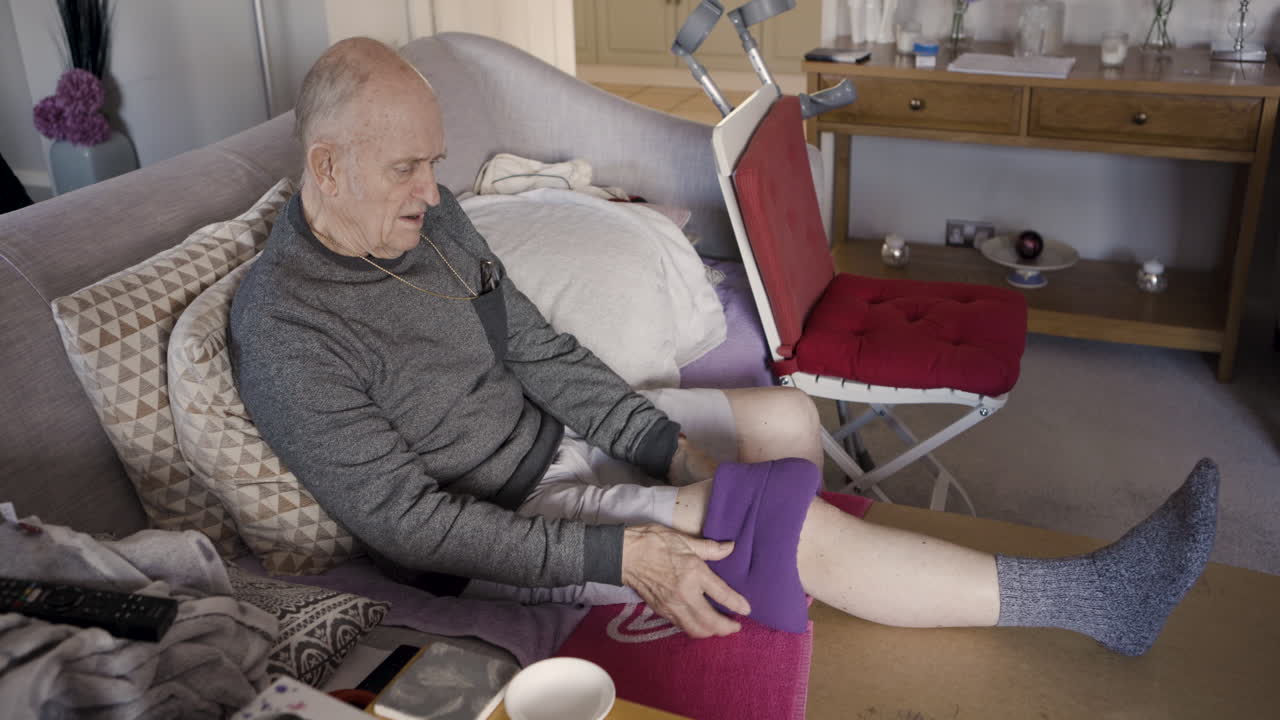 Elderly man recovering from injury at home