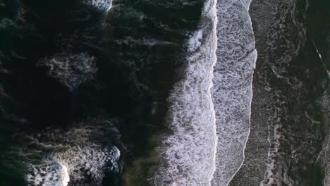 Overhead-aerial-of-breaking-waves-soothing-and-peaceful